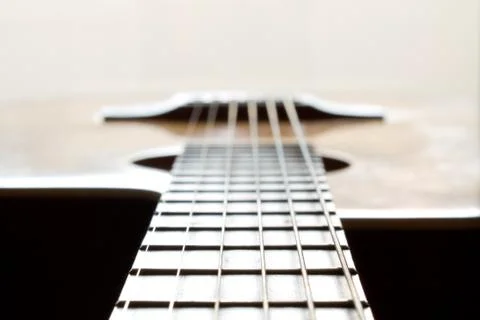 Fragment of an acoustic guitar - closeup shot Stock Photos