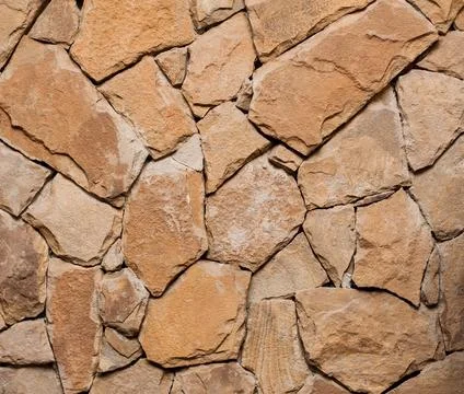 Fragment of the ancient stone wall executed from stones of various form and.. Foto stock