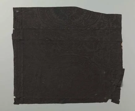 Fragment black silk damest with pattern of a stylized pomegranate motifs. ... Stock Photos