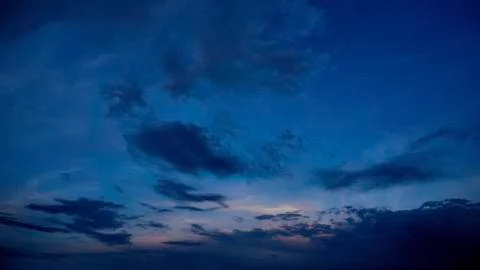 Fragment of a blue sky with white clouds. Summer beautiful sunny day. Moving Stock Photos