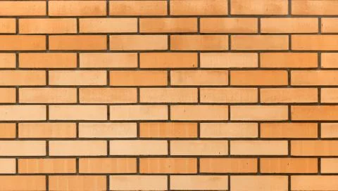 Fragment of a brick wall. Stock Photos