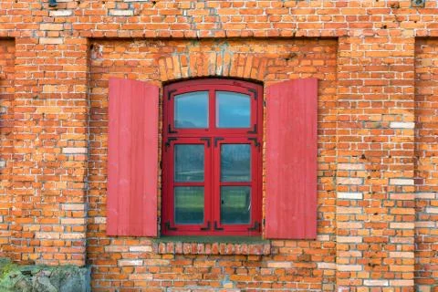 Fragment of a brick wall with a window Stock Photos