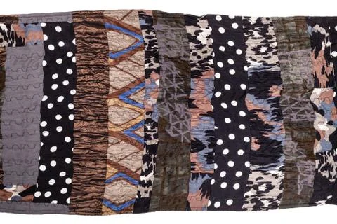 Fragment of brown patchwork scarf isolated Foto stock