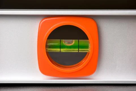 Fragment of the bubble level with the indicator flask of spirit level Stock Photos