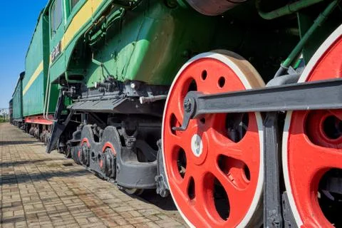Fragment of the chassis of the old engine, wheels, springs, axle boxes, pisto Stock Photos