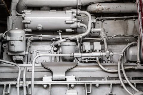 Fragment of a complex mechanical aggregate with various communication and Stock Photos