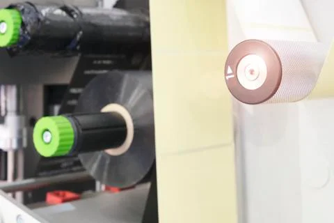 Fragment of the conveyor of sticking labeling machine. Abstract industrial ba Foto stock