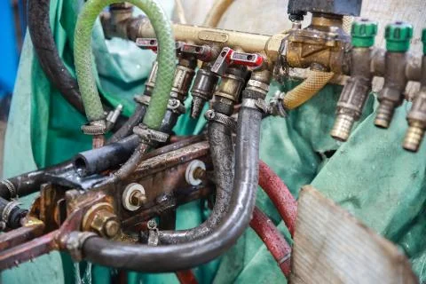 Fragment of the cooling system of the machine tool. Industrial background. Stock Photos