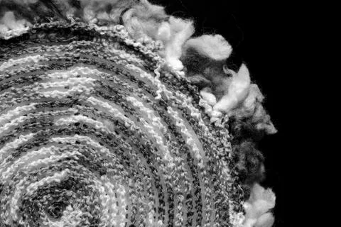 Fragment of a crocheted circle from melange threads based on a plastic canvas Stock Photos