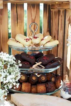 Fragment of a dessert table. cake pops in trouble and dark chocolate and cann Stock Photos