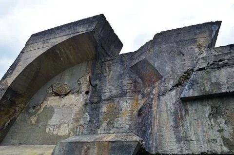 A fragment of the destroyed concrete structure on the background of the sky Stock-Fotos