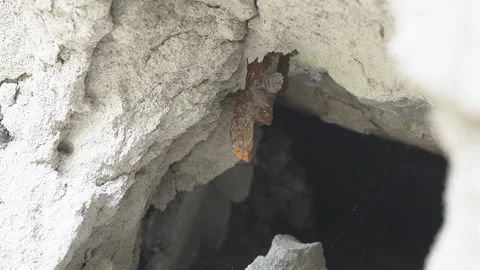 A fragment of an exploding mine sticking out in the wall Stock Footage 201814643