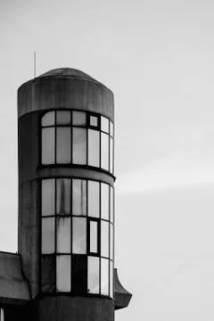 Fragment of the facade building with a rounded shape against the sky. Stock Photos