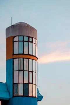 Fragment of the facade building with a rounded shape against the sky. Stock Photos