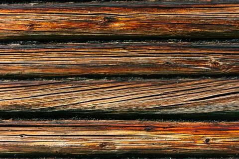 Fragment of the facade of a log wall. Rustic log wall horizontal wood backgro Stock Photos