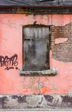 Fragment of facade of an old devastated building Stock Photos