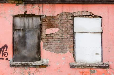 Fragment of facade of an old devastated building Stock Photos