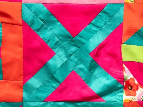 Fragment of hand-sewn patchwork fabric Stock Photos