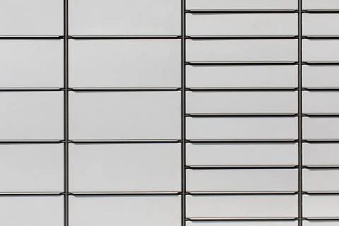 A fragment of a huge parcel locker with separate drawers for different sizes of Stock Photos