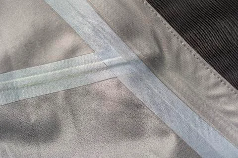Fragment of the inside of a green gray jacket Stock Photos