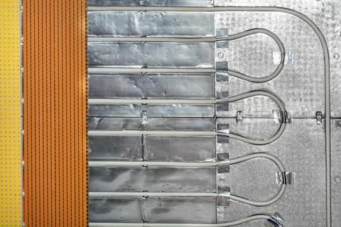 Fragment of installation of underfloor heating system with water heating. Stock Photos