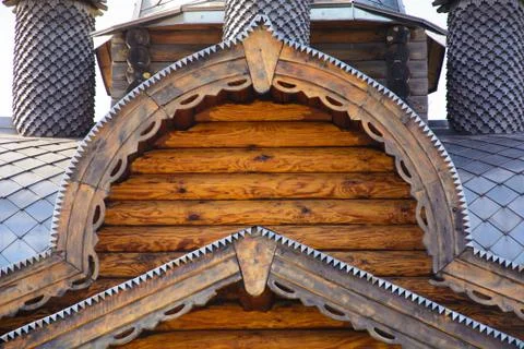 Fragment of a log house with elements of Russian architecture, wooden carvings Stock Photos
