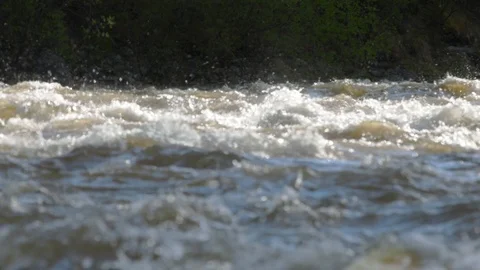 A Fragment a mountain river flows against the background of the shore with sound Stock Footage 125894877