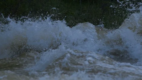 Fragment of a muddy mountain river. River spray bounces Stock Footage 126992978