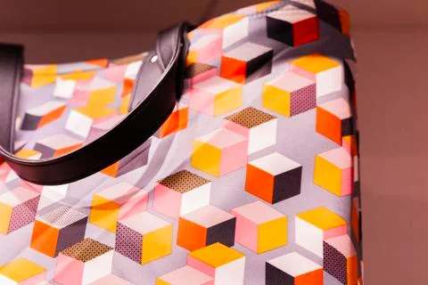 Fragment of multi-colored print shopper bag imitation leather Stock Photos