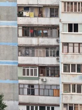 Fragment of a multi-storey building of Soviet architecture Stock Photos