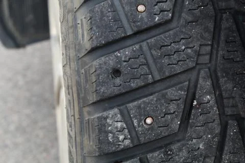 Fragment of the old car wheel with the missing thorn for safe driving. Stock Photos