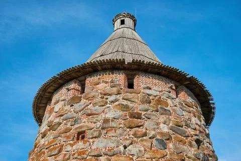 Fragment of an old monastery tower Stock Photos
