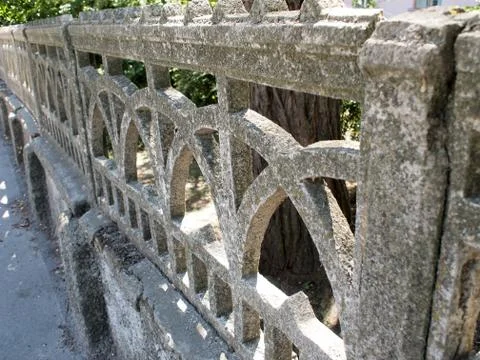 Fragment of an old stone wall of openwork casting Stock Photos