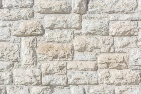 Fragment of an old stone wall. Stock Photos