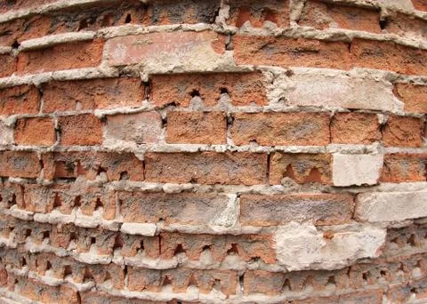Fragment of the old wall of the destroyed bricks Stock Photos