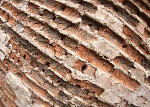 Fragment of the old wall of the destroyed bricks Stock Photos