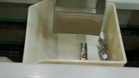 Fragment of the packaging process for small parts of furniture fittings. Stock Footage 143490746