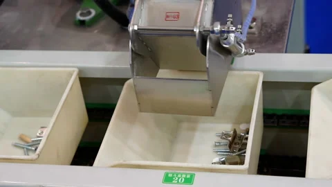 Fragment of the packaging process for small parts of furniture fittings. Stock Footage 143490764