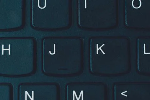 Fragment of personal computer keyboard closeup, black keyboard. Stock Photos