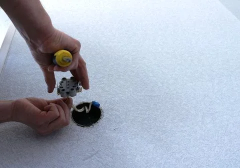 Fragment of the process of installing a double socket Stock Photos