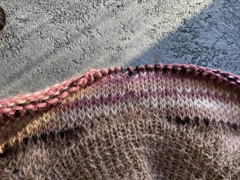 Fragment process of warm striped raglan sweater Stock Photos