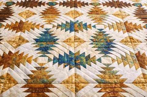 Fragment of quilt stitched from pineapple pattern blocks, traditional patchwo Fotos de archivo