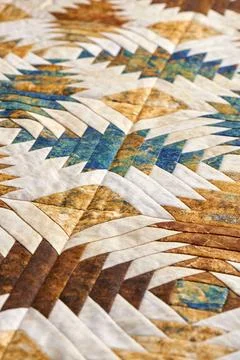 Fragment of quilt stitched from pineapple pattern blocks, traditional patchwo Fotos de archivo
