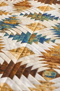Fragment of quilt stitched from pineapple pattern blocks, traditional patchwo Stock-Fotos