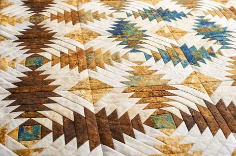 Fragment of quilt stitched from pineapple pattern blocks, traditional patchwo Stock Photos