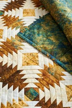 Fragment of quilt stitched from pineapple pattern blocks, traditional patchwo Fotos de archivo