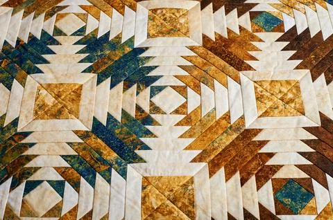 Fragment of quilt stitched from pineapple pattern blocks, traditional patchwo Stock Photos