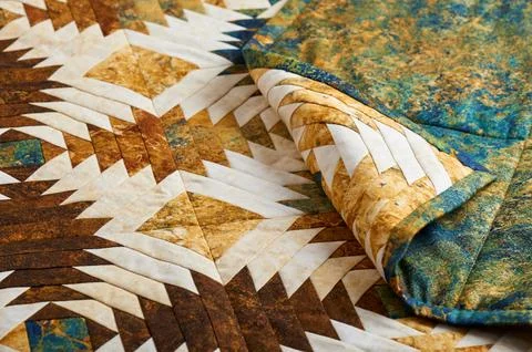 Fragment of quilt stitched from pineapple pattern blocks, traditional patchwo Stock Photos