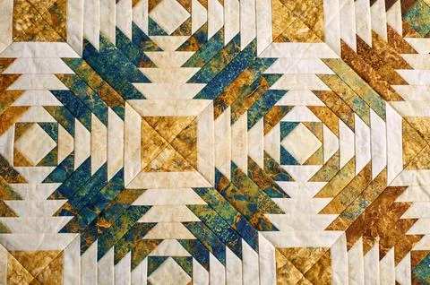 Fragment of quilt stitched from pineapple pattern blocks, traditional patchwo 스톡 사진