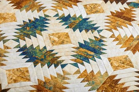 Fragment of quilt stitched from pineapple pattern blocks, traditional patchwo Stock Photos